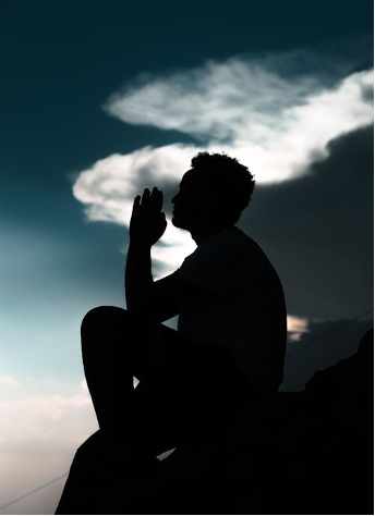Man in shadow meditating